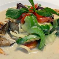 Gaeng Keow Wan Salmon · Grilled salmon filet topped with spicy green curry coconut milk, bamboo shoot, green bean, e...
