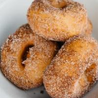 Donuts · four housemade donuts, dusted in nutmeg, cinnamon sugar