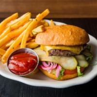 Americana Burger · beef patty, cheddar cheese, lettuce, tomato, pickled onions, pickles, and mayo on a bun. Ser...