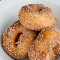 Donuts · four housemade donuts, dusted in nutmeg, cinnamon sugar