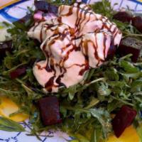 Beet Salad · Roast beets, wild arugula, fresh burrata & balsamic reduction.