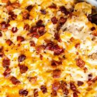 Chicken Bacon Ranch Mac and Cheese · Classic mac and cheese with sliced chicken, bacon bits, sliced scallions, topped with a driz...