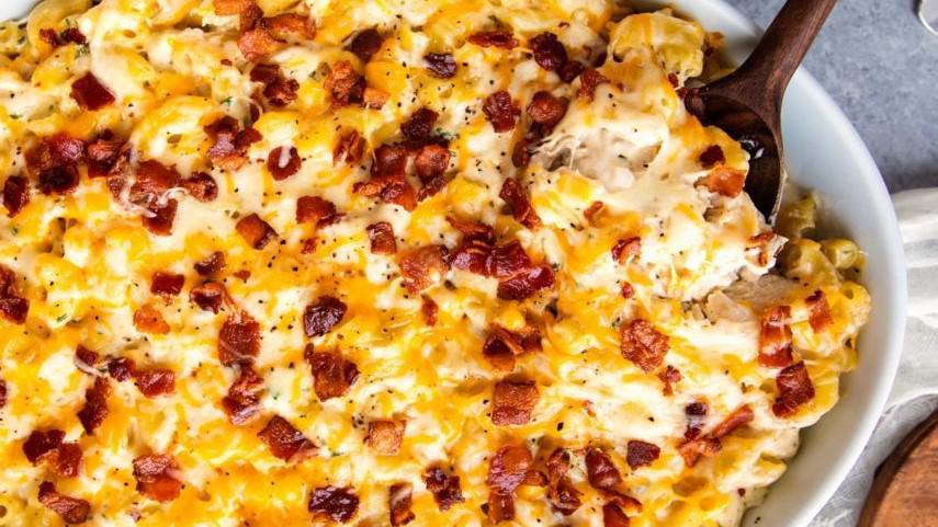 Chicken Bacon Ranch Mac and Cheese · Classic mac and cheese with sliced chicken, bacon bits, sliced scallions, topped with a drizzle of ranch.