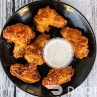 Chicken Wings (Bone-in) · Oven baked crispy chicken wings in various flavors