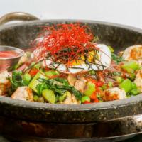 Hot Stone Pot · Sautéed assorted vegetables, sunnyside up egg and smoked chili sauce over rice. Sriracha on ...