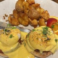 Classic Benny · Canadian bacon. Easy poached eggs on English muffin topped with meyer lemon hollandaise. Ser...