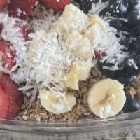 Acai Bowl · Pure acai, granola, strawberry, banana and coconut flakes.