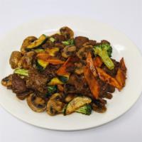 Mushroom Beef · Flank steak beef sauteed with fresh mushrooms, broccoli, zucchini and carrots.