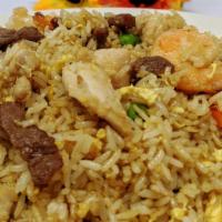 House Fried Rice · House fried rice includes shrimp, chicken and beef.