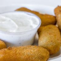 Jalapeño Poppers · Breaded jalapeno stuffed with cheese.