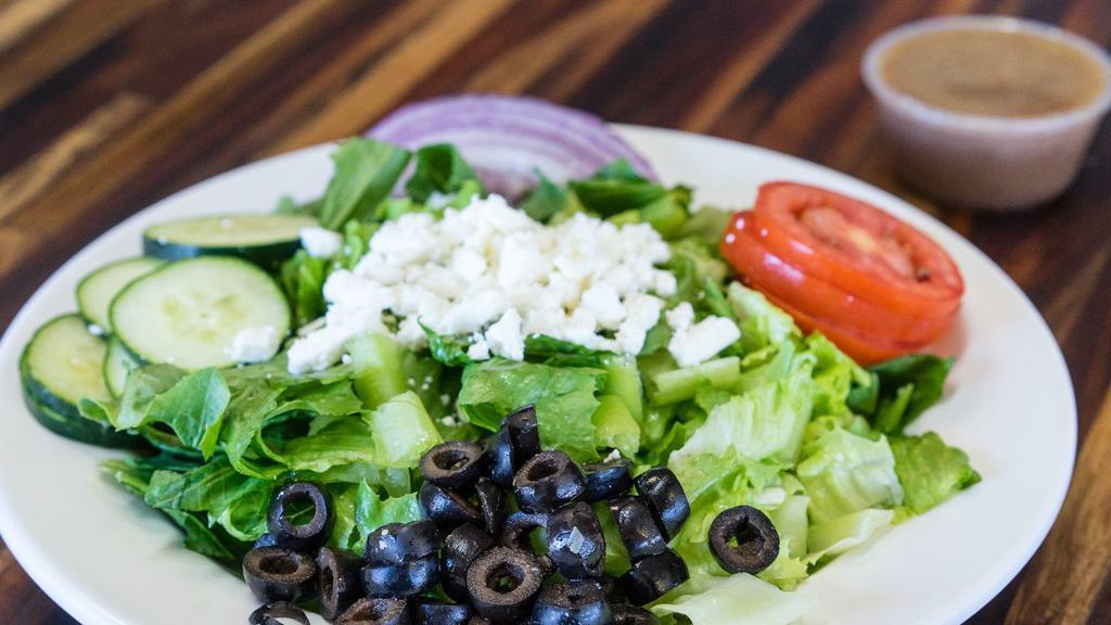 Greek Salad · Romaine lettuce, cucumbers, black olives and red onions,slice tomato, feta cheese and Greek dressings.