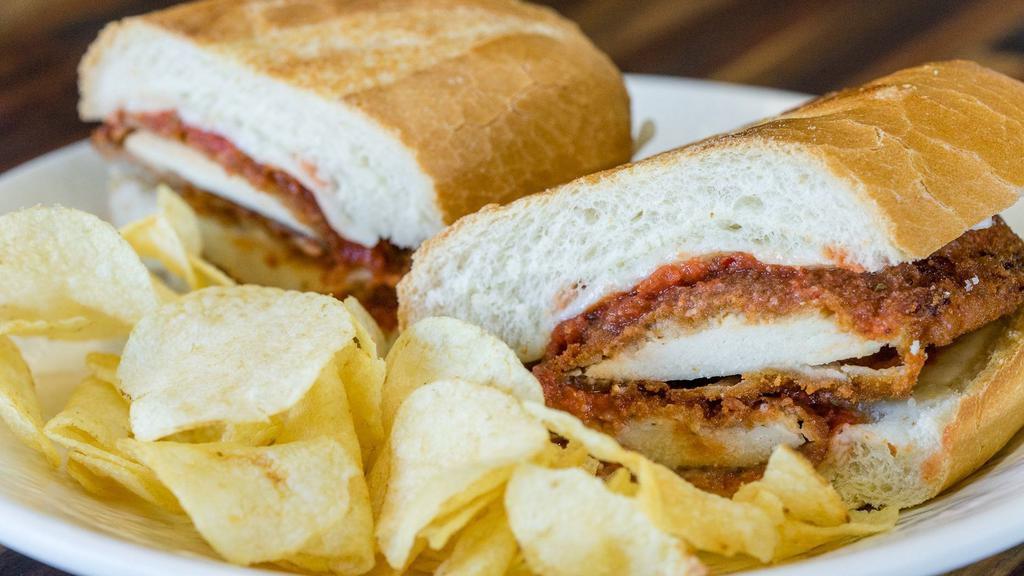 Chicken Parm Sub · Bread chicken breast on a soft roll with melted mozzarella and marinara.