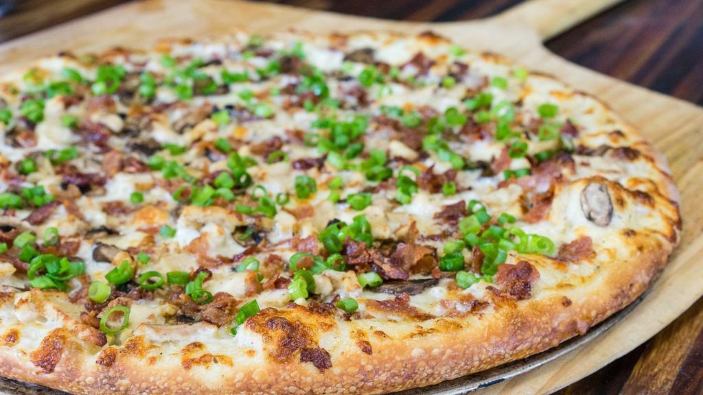 Lightning Bear · White lightning garlic Sauce, grilled chicken breast, applewood smoked bacon, mushrooms and green onions.