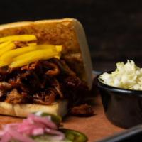 Regular Squealin Pig · Slow cooked pulled pork in our Spicy BBQ sauce. Served with your choice of side.