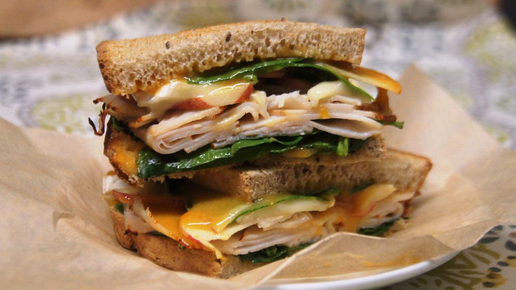 Turkey with Brie · Toasted rye, apricot mustard, spinach, sliced apples. Choose Turkey or Ham.