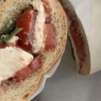 The Caprese Sandwich · Fresh mozzarella, tomato, basil with salt and pepper, oil, and vinegar.