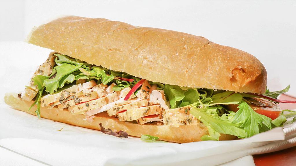 The Petto di Pollo Sandwich · Mediterranean Chicken Breast Rubbed with Garlic, Lemon Peel and spice, Swiss Cheese with Organic Mixed Greens, Pepperoncini, Tomato, Black Pepper, Olive Oil & Balsamic Vinegar.