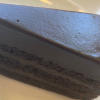 CHOCOLATE FONDANT · Chocolate layer cake filled with a rich chocolate cream, covered with chocolate ganache & ri...