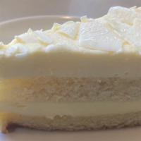 LIMONCELLO MASCARPONE CAKE · A rich combination of sicillian lemon infused sponge cake & italian mascarpone topped with e...