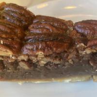PECAN PIE · Large pecan pieces combined with dark corn syrup, brown sugar & butter are poured into a but...