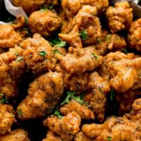 Chicken Pakora · Chicken battered with chickpea and Indian Spices comes with tamarind sauce.