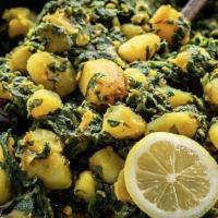 Palak Daal / Saag Daal · Yellow lentils, spinach, curry leaf cooked with Indian spices.