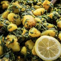 Aloo Palak · Boiled potatoes, cooked spinach, Indian spices cooked with homemade tomato sauce.