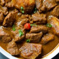 Lamb Curry · Lamb cooked with curry sauce and Indian spices.