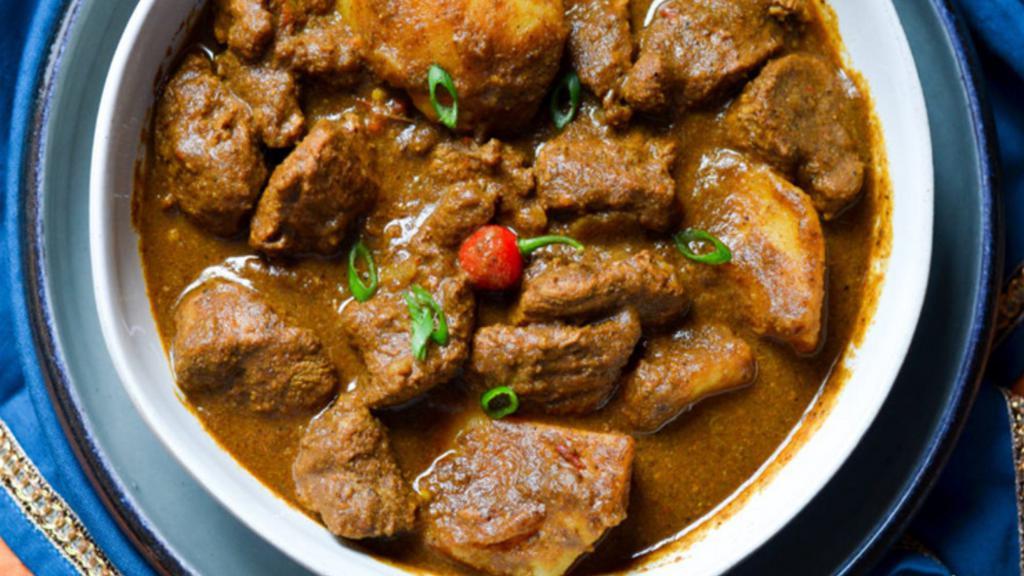 Lamb Curry · Lamb cooked with curry sauce and Indian spices.