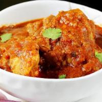 Chicken Curry · Chicken, Indian spices, cooked with homemade special curry sauce.