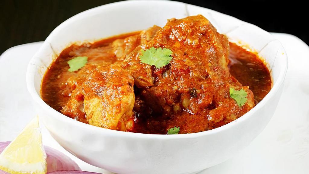 Chicken Curry · Chicken, Indian spices, cooked with homemade special curry sauce.
