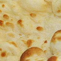 Plain Naan · Bread made with all-purpose flour, milk, eggs, baking powder, sugar, salt, baked in tandoor.
