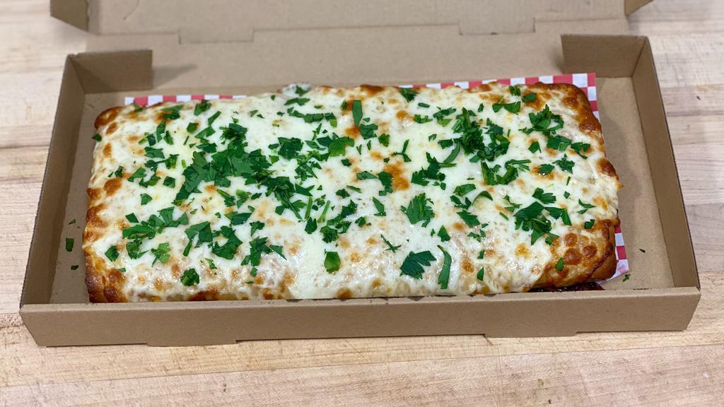 Garlic Cheese Bread · Mozzarella, garlic butter, parmesan, parsley. Two dipping sauce included.