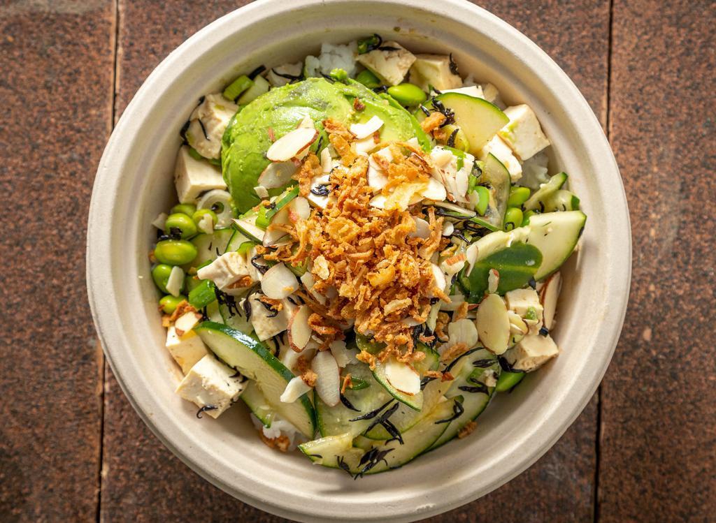 Veggie Bowl · Organic tofu, avocado, seaweed salad, and a bit of all of our veggies, topped off with toasted sesame seeds