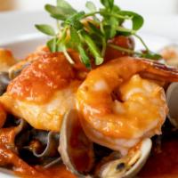 Seafood Pasta · prawns / sea scallops / clams / calamari / rock cod / squid ink pasta / tomato broth