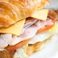 Turkey Club With Bacon  Croissant · included mayo, lettuce tomatoes, cheese, onside red onion, dill pickel pepperoncini