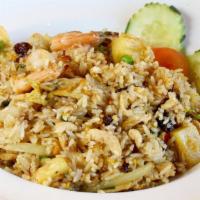 Pineapple Fried Rice · Fried rice with chicken & prawns, egg, peas, carrot, pineapple, raisins, cashew nuts, onion,...