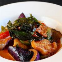 Spicy Catfish · Crispy catfish wok tossed with eggplant, bell peppers and kaffir lime leaves, wild ginger in...