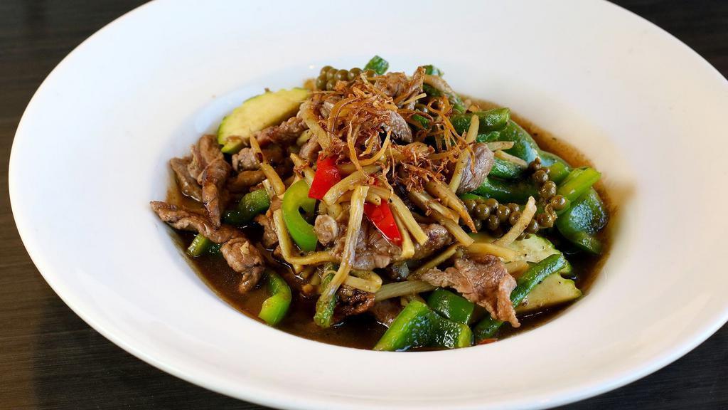 Jungle Lamb · Australian lamb, green bean, zucchini, bamboo shoot, bell pepper, wild ginger, and green peppercorn sautéed with green curry paste. Top with fried wild ginger. No coconut milk served with white rice.