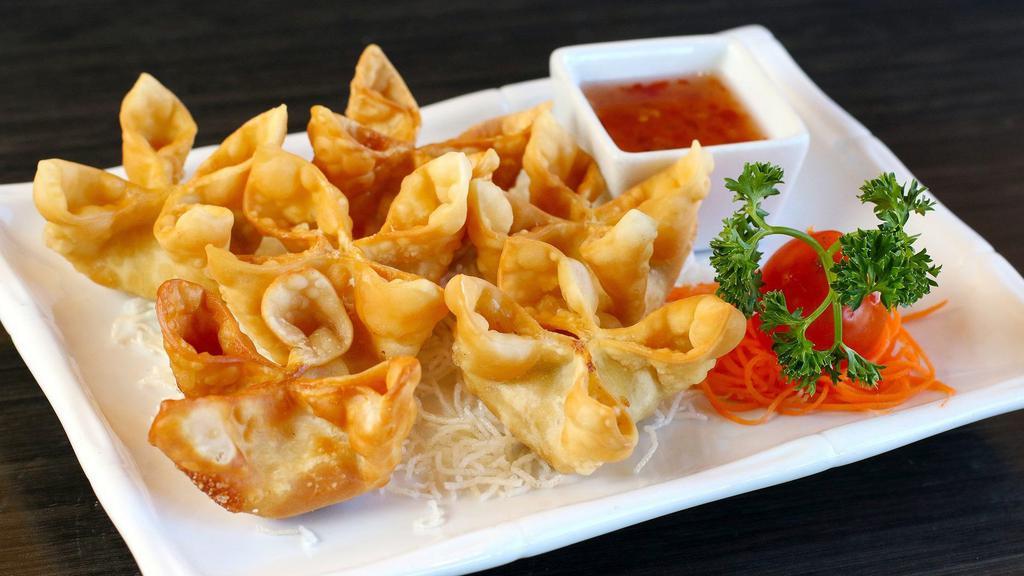 Crab Rangoon · Cream cheese, white crab meats, scallion, onion, water chestnut, carrot, and spices. Served with sweet and sour sauce.