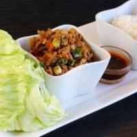 Chicken Lettuce Wraps · Minced chicken, water crest, carrot, fresh ginger, green onion served with lettuce.