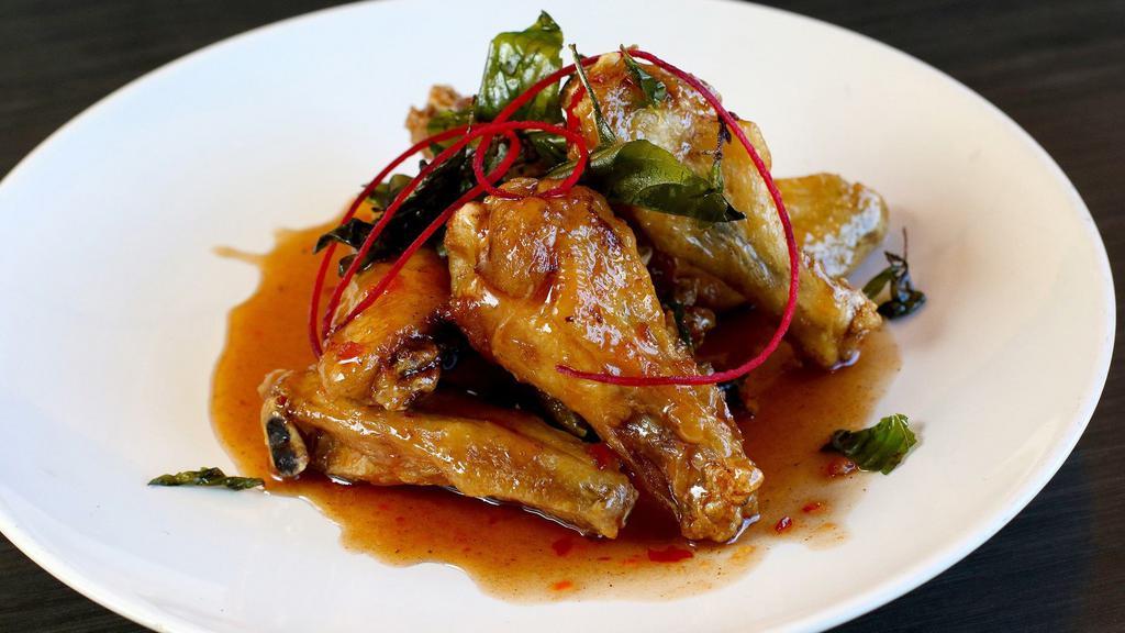 Angel Wings · Crispy chicken wings glazed in chef’s special sweet, smoked Thai chili sauce topped with crispy sweet basil.