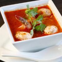 Tom Yum (Cup) · Spicy and sour lemongrass soup with galangal and kaffir lime leaves. Served with mushroom, t...