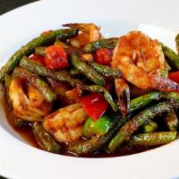 Spicy String Beans · Sautéed green beans, bell peppers in a light red curry paste sauce  served with white rice.