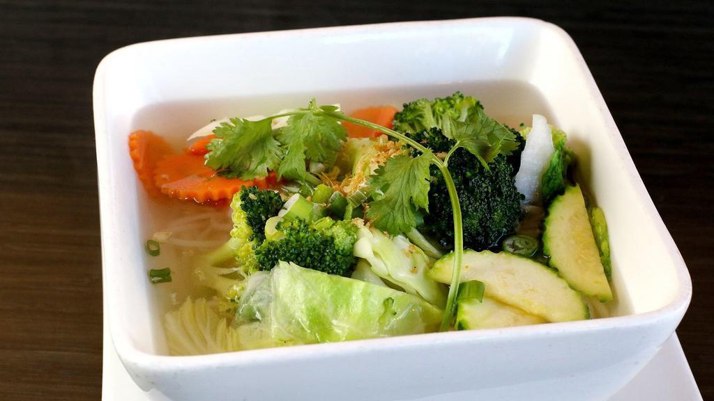 Tofu & Vegetable  noodle soup · Soft tofu and assorted of vegetables, green onion, cilantro, toasted garlic, and rice noodles in vegetable broth.