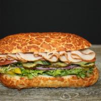 Turkey  · Served with mayo, mustard, lettuce, pickle, tomato, peppercini, sprout, onions and cucumber.