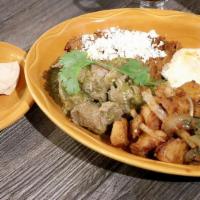 Chile Verde And Eggs · Savory pork chunks cooked in tomatillo sauce, served with two eggs any style, a side order o...