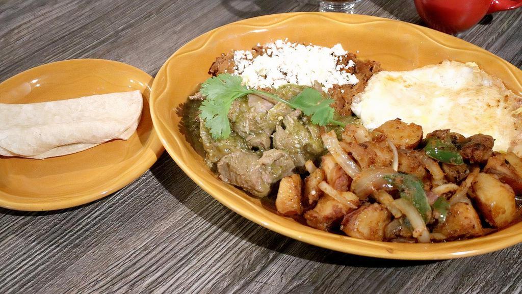 Chile Verde & Eggs · Fresh pork chunks cooked in tomatillo sauce, served with two eggs any style and a side order of refried beans and corn tortillas.
