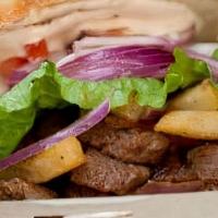 Lomo Saltado Sandwich · Beef tenderloin, tomatoes, onions, pisco-soy reduction with fries and chile rocoto aioli.