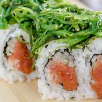 Poki · Spicy tuna roll topped with seaweed salad.